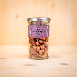 Randen-Nussmix RAUNA BIO mit Randen und Rosmarin in einem Glasbehälter, knusprige Nüsse, handgefertigt.