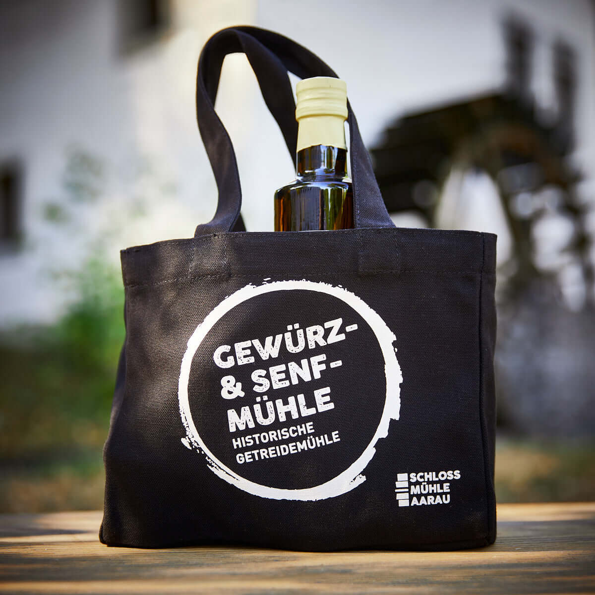 Geschenktasche aus Baumwolle schwarz mit Logo bedruckt